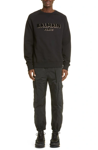 Shop Balmain Flocked Metallic Logo Cotton Graphic Sweatshirt In Black/ Gold
