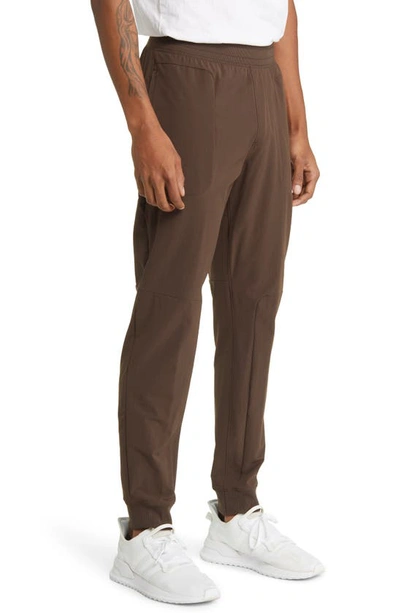 Shop Alo Yoga Co-op Pocket Tapered Joggers In Espresso