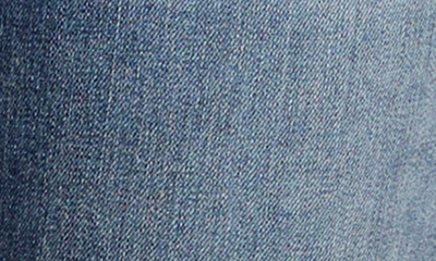 Shop Silver Jeans Co. Elyse Distressed Capri Jeans In Indigo