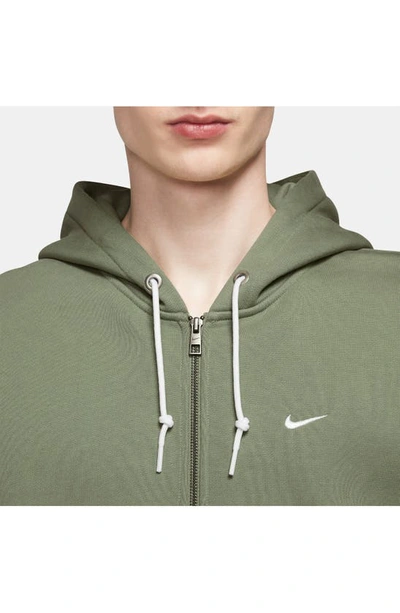 Shop Nike Solo Swoosh Zip Hoodie In Oil Green/ White