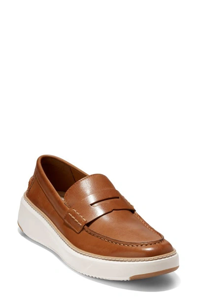 Shop Cole Haan Grandpro Topspin Penny Sneaker In British Tan/ Egret