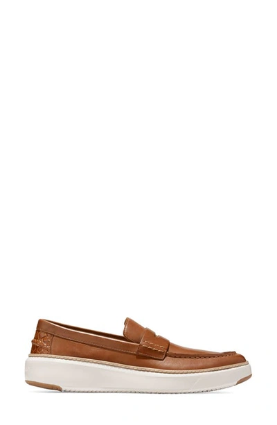 Shop Cole Haan Grandpro Topspin Penny Sneaker In British Tan/ Egret