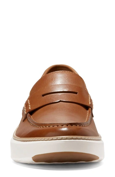 Shop Cole Haan Grandpro Topspin Penny Sneaker In British Tan/ Egret