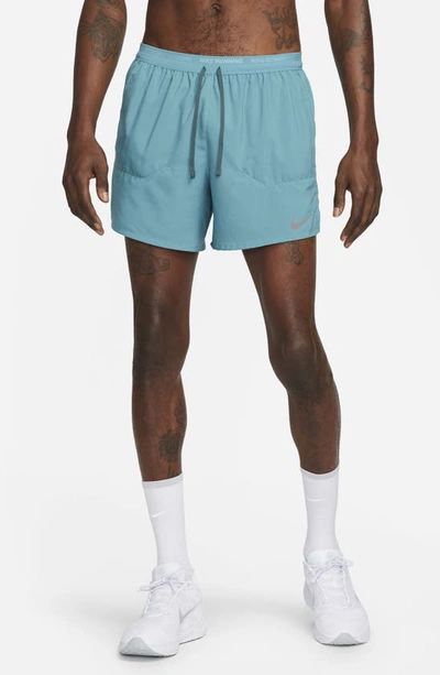 Shop Nike Dri-fit Stride 5-inch Running Shorts In Mineral Teal/ Faded Spruce