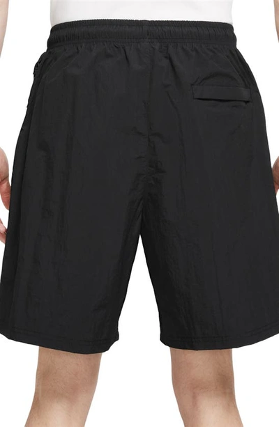 Shop Nike Solo Swoosh Water Repellent Nylon Shorts In Black/ White