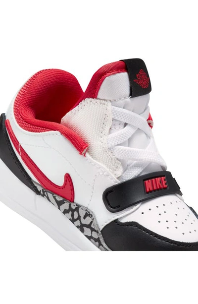 Shop Nike Jordan Legacy 312 Low Sneaker In White/ Fire Red/ Black/ Grey