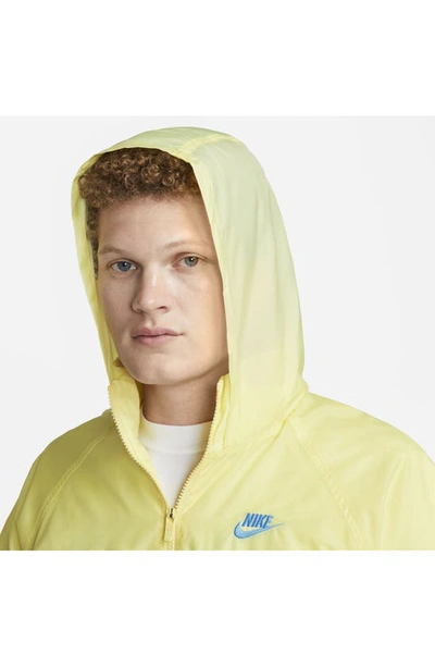 Shop Nike Water Repellent Half Zip Pullover In Lemon Chiffon/ University Blue
