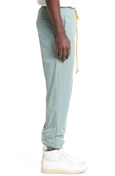 Shop Rhude Senna Logo Nylon Track Pants In Sage/ Ivory