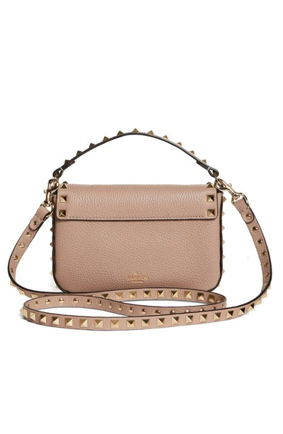 Shop Valentino Garavani Rockstud Leather Top Handle Bag In P45 Poudre