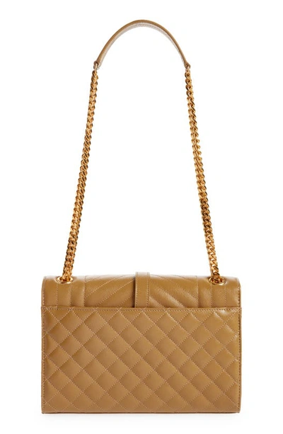 Shop Saint Laurent Medium Cassandra Quilted Leather Envelope Bag In 3331 Golden