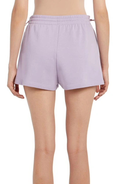 Shop Moncler Splatter Logo Cotton Blend Graphic Sweat Shorts In Purple
