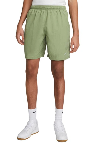 Nike Solo Swoosh Water Repellent Stretch Nylon Shorts In Green | ModeSens
