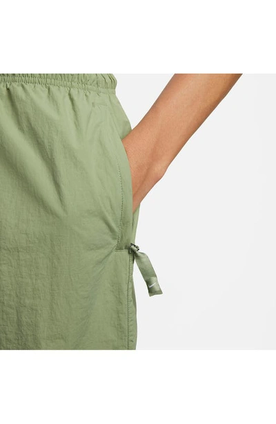 Shop Nike Solo Swoosh Water Repellent Nylon Shorts In Oil Green/ White