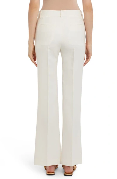 Shop Valentino Flare Crepe Couture Pants In A03-avorio