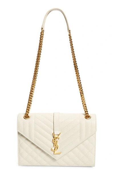 Shop Saint Laurent Medium Cassandra Quilted Leather Envelope Bag In Ivory