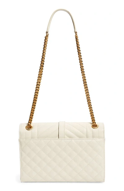 Shop Saint Laurent Medium Cassandra Quilted Leather Envelope Bag In Ivory