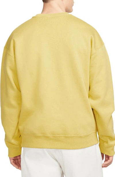 Shop Nike Solo Swoosh Oversize Crewneck Sweatshirt In Saturn Gold/ White