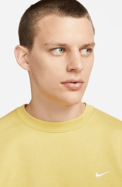 Shop Nike Solo Swoosh Oversize Crewneck Sweatshirt In Saturn Gold/ White