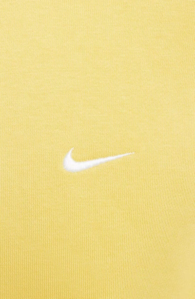 Shop Nike Solo Swoosh Oversize Crewneck Sweatshirt In Saturn Gold/ White