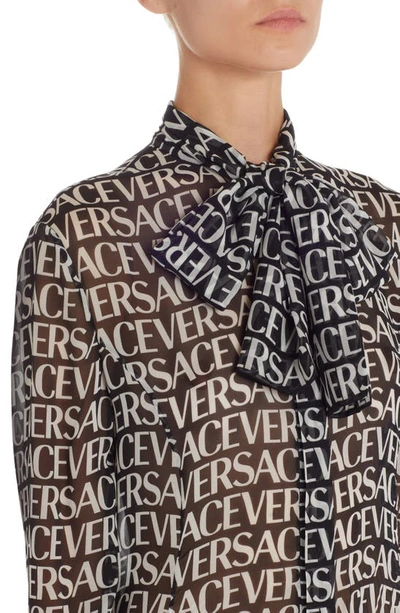 Shop Versace Logo Print Semisheer Long Sleeve Silk Midi Dress In Black/ White