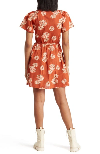 Shop Madewell Floral Print Wrap Minidress In Rusty Torch