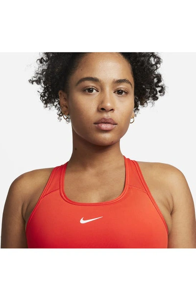 Shop Nike Swoosh Dri-fit Racerback Sports Bra In Picante Red/ White