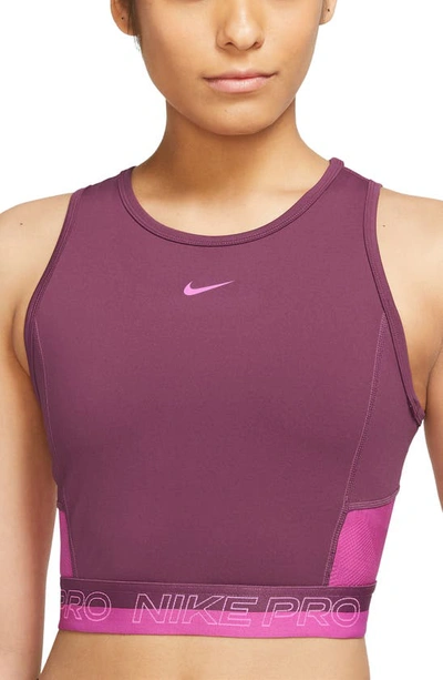 Shop Nike Pro Dri-fit Crop Tank In Rosewood/ Pinksicle