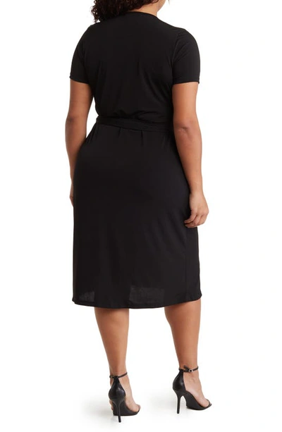 Shop Renee C Solid Jersey Wrap Dress In Black