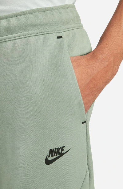 Shop Nike Tech Fleece Jogger Sweatpants In Mica Green/ Black