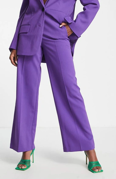 Shop Asos Design Relaxed Wide Leg Suit Trousers In Purple