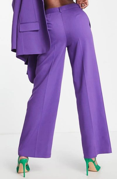 Shop Asos Design Relaxed Wide Leg Suit Trousers In Purple