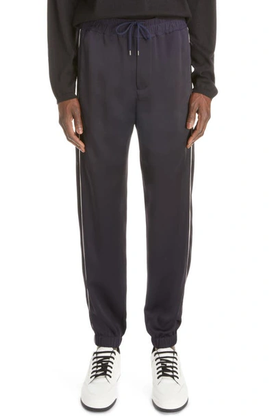 Shop Saint Laurent Piped Satin Joggers In Marine Fonce