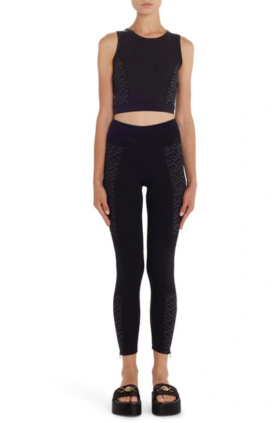 Shop Versace La Greca Zip Hem Leggings In Nero