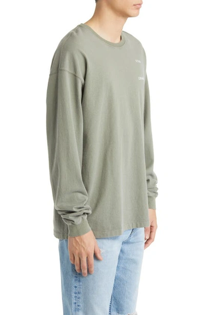 Shop Frame Faded Washed Long Sleeve Graphic Tee In Old Green