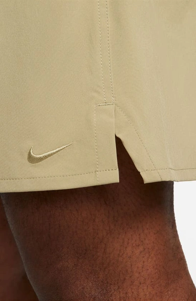 Shop Nike Dri-fit Unlimited 7-inch Unlined Athletic Shorts In Neutral Olive/ Black