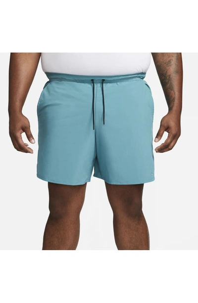 Shop Nike Dri-fit Unlimited 7-inch Unlined Athletic Shorts In Mineral Teal/ Black