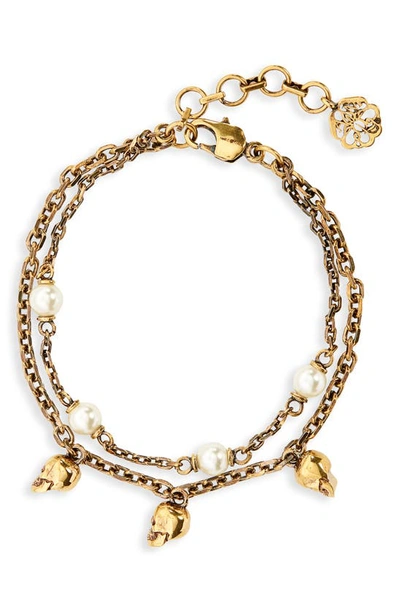 Shop Alexander Mcqueen Imitation Pearl & Skull Layered Bracelet In 2375 Antique Gold - Pearl