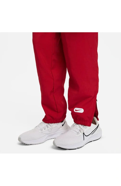 Shop Nike Kids' Athletics Repel Training Pants In Gym Red/ White/ White/ White