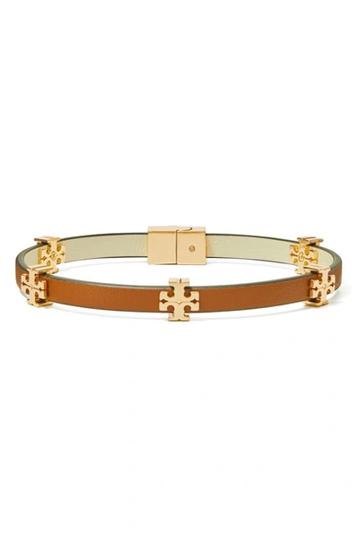 Shop Tory Burch Eleanor Station Hinge Bracelet In Tory Gold / Cuoio