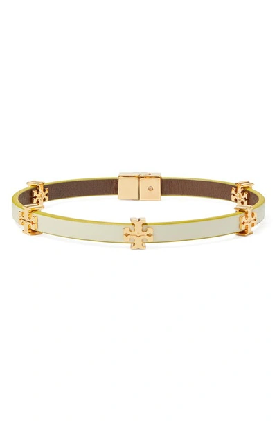 Shop Tory Burch Eleanor Station Hinge Bracelet In Tory Gold / New Ivory