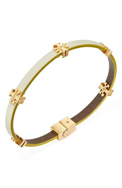 Shop Tory Burch Eleanor Station Hinge Bracelet In Tory Gold / New Ivory