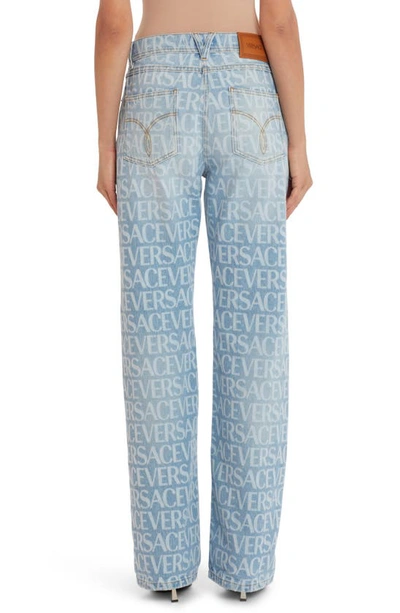 Shop Versace Logo Print Straight Leg Jeans In Blue