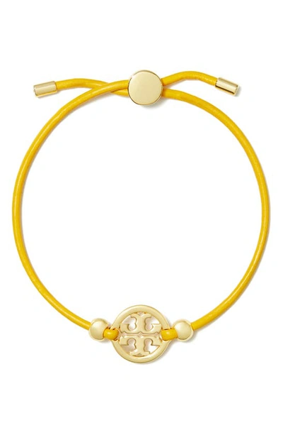 Shop Tory Burch Miller Logo Slider Bracelet In Tory Gold / Goldfinch