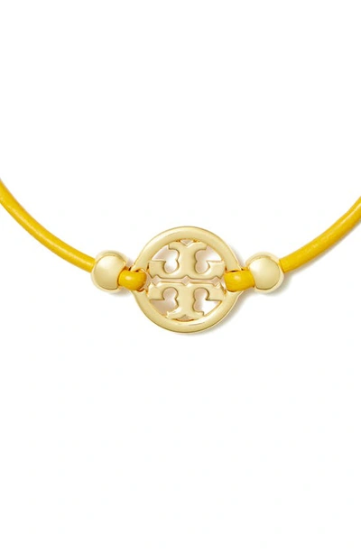 Shop Tory Burch Miller Logo Slider Bracelet In Tory Gold / Goldfinch