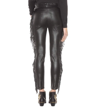Shop Saint Laurent Fringed Leather Trousers
