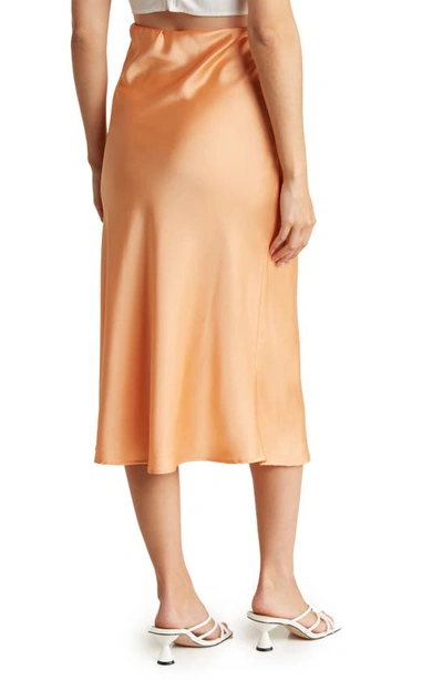 Shop Renee C Solid Satin Midi Skirt In Melon