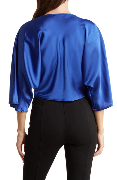 Shop Renee C Plunge Neck Long Sleeve Twisted Knot Satin Top In Royal Blue