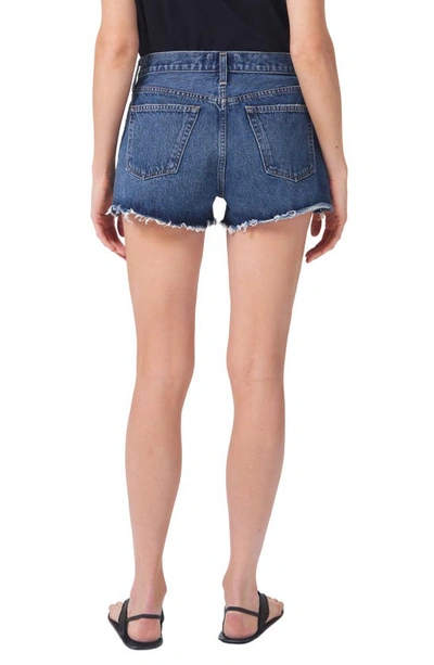 Shop Agolde Parker Cutoff High Waist Relaxed Organic Cotton Denim Shorts In Caution