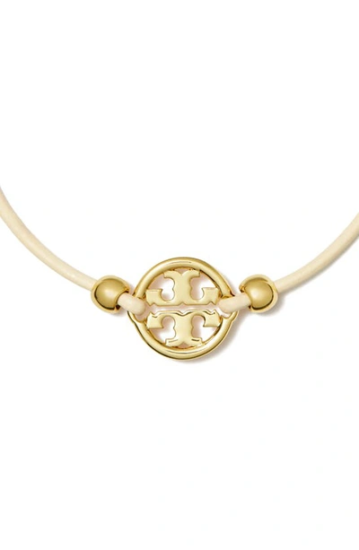 Shop Tory Burch Miller Logo Slider Bracelet In Tory Gold / Ivory