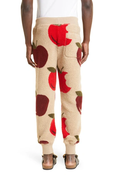 Shop Jw Anderson Apple Print Fleece Joggers In Beige/ Red
